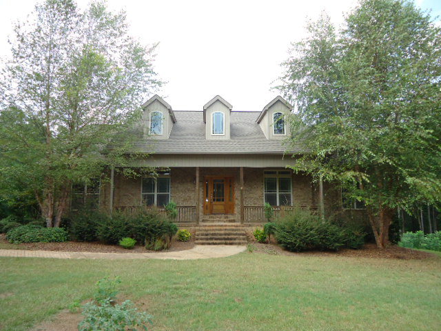798 McKay Road Gray, GA 31032 - Photo 1 of 1 a front view of a house with garden
