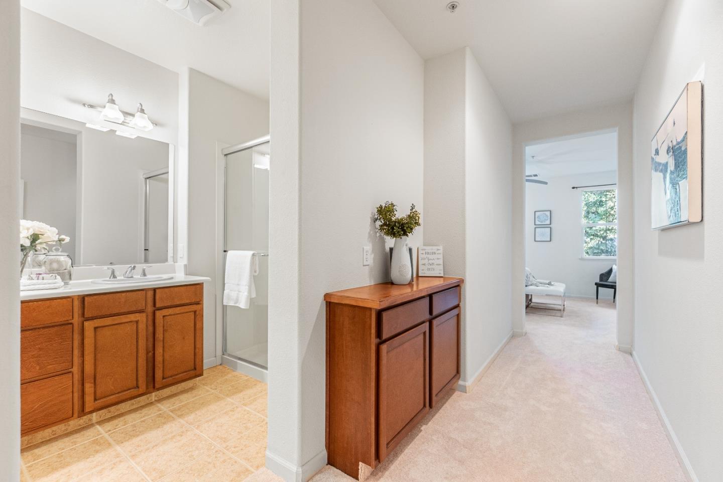 2197 Beech Circle San Jose, CA 95131 - Photo 19 of 32 a spacious bathroom with a double vanity sink and a mirror