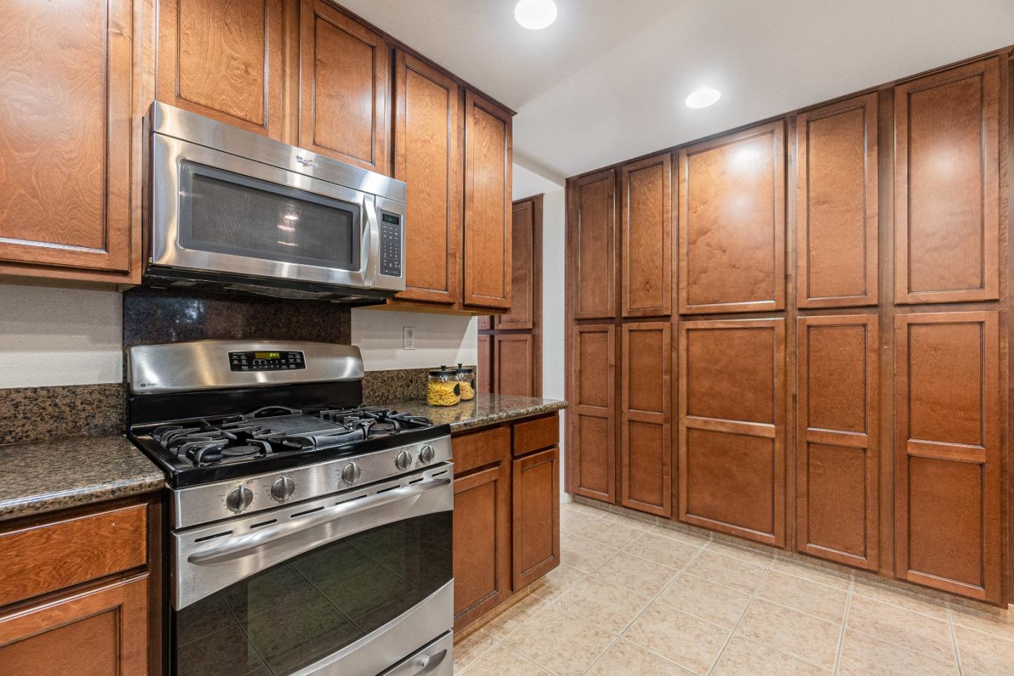 2197 Beech Circle San Jose, CA 95131 - Photo 10 of 32 a kitchen with granite countertop cabinets and steel stainless steel appliances