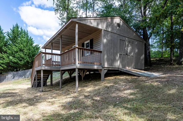 a view of a house with a yard and roof