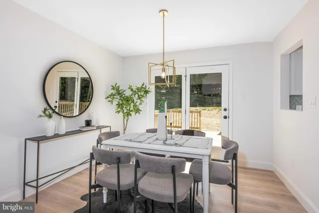 a dining room with a large window and table