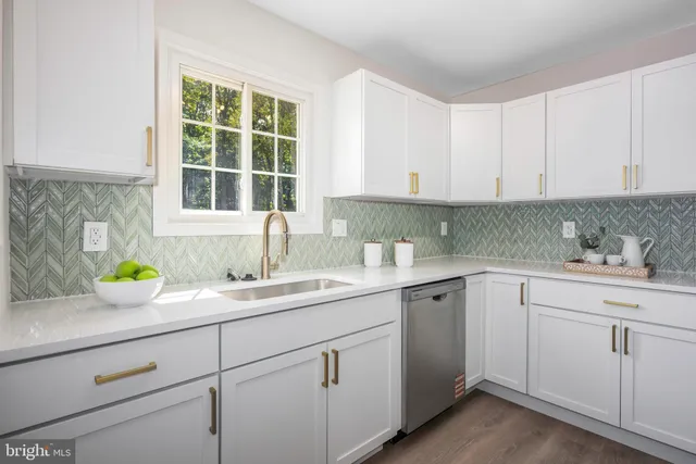 a kitchen with sink and window
