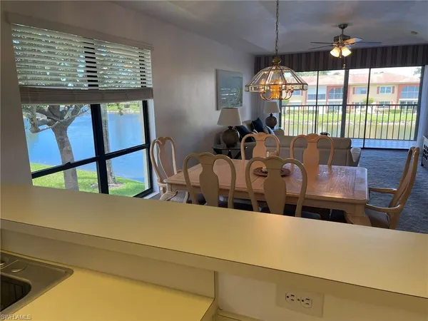 a view of kitchen with furniture and window