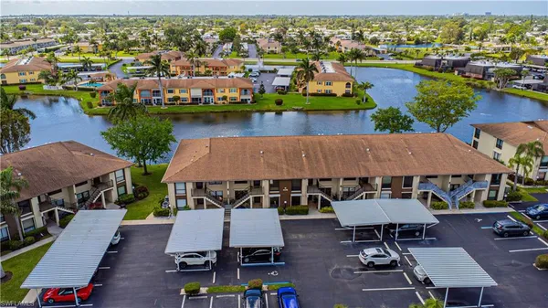 an aerial view of houses with yard