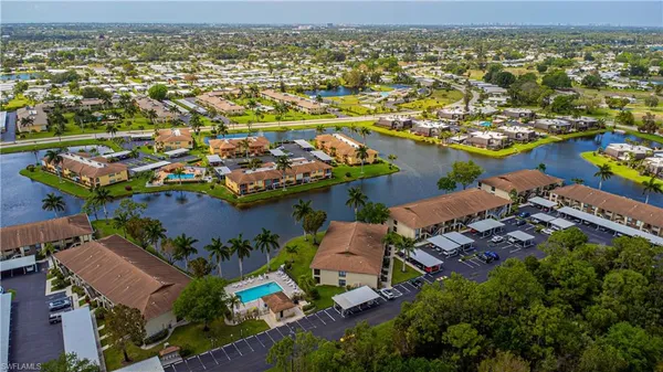 an aerial view of residential houses with outdoor space