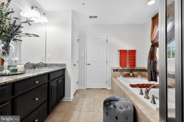 a room with a bed and a mirror