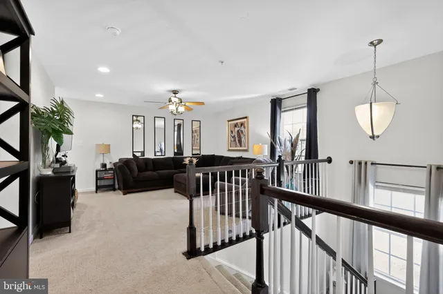 a view of a livingroom with furniture and windows