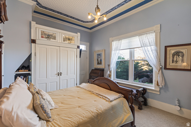 390 North 100 West Monroe, UT 84754 - Photo 92 of 167 Carpeted bedroom with crown molding, a closet, a chandelier, and a tray ceiling