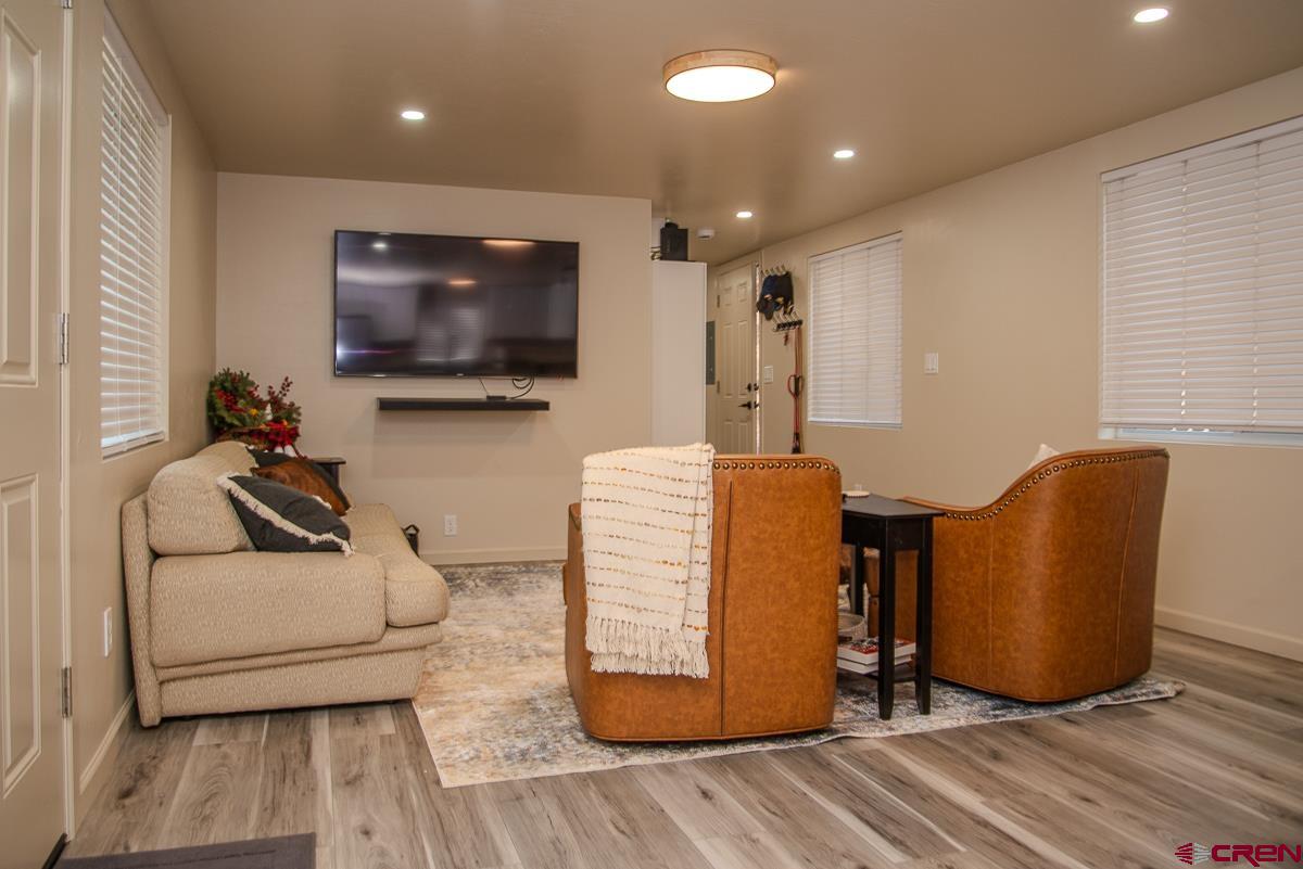 40 Hidden Lane Durango, CO 81303 - Photo 13 of 38 a living room with furniture and a flat screen tv