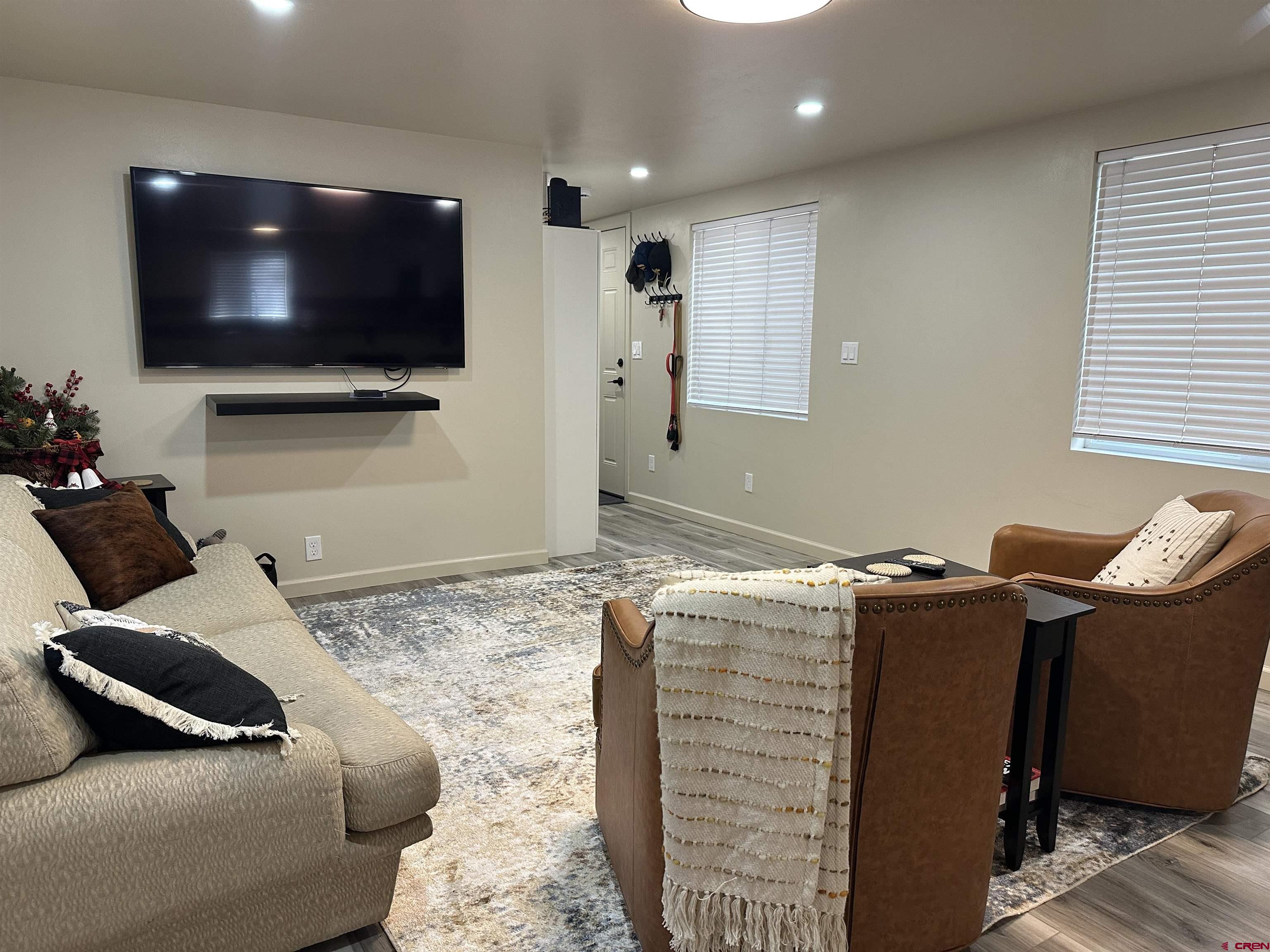 40 Hidden Lane Durango, CO 81303 - Photo 14 of 38 a living room with furniture and a flat screen tv