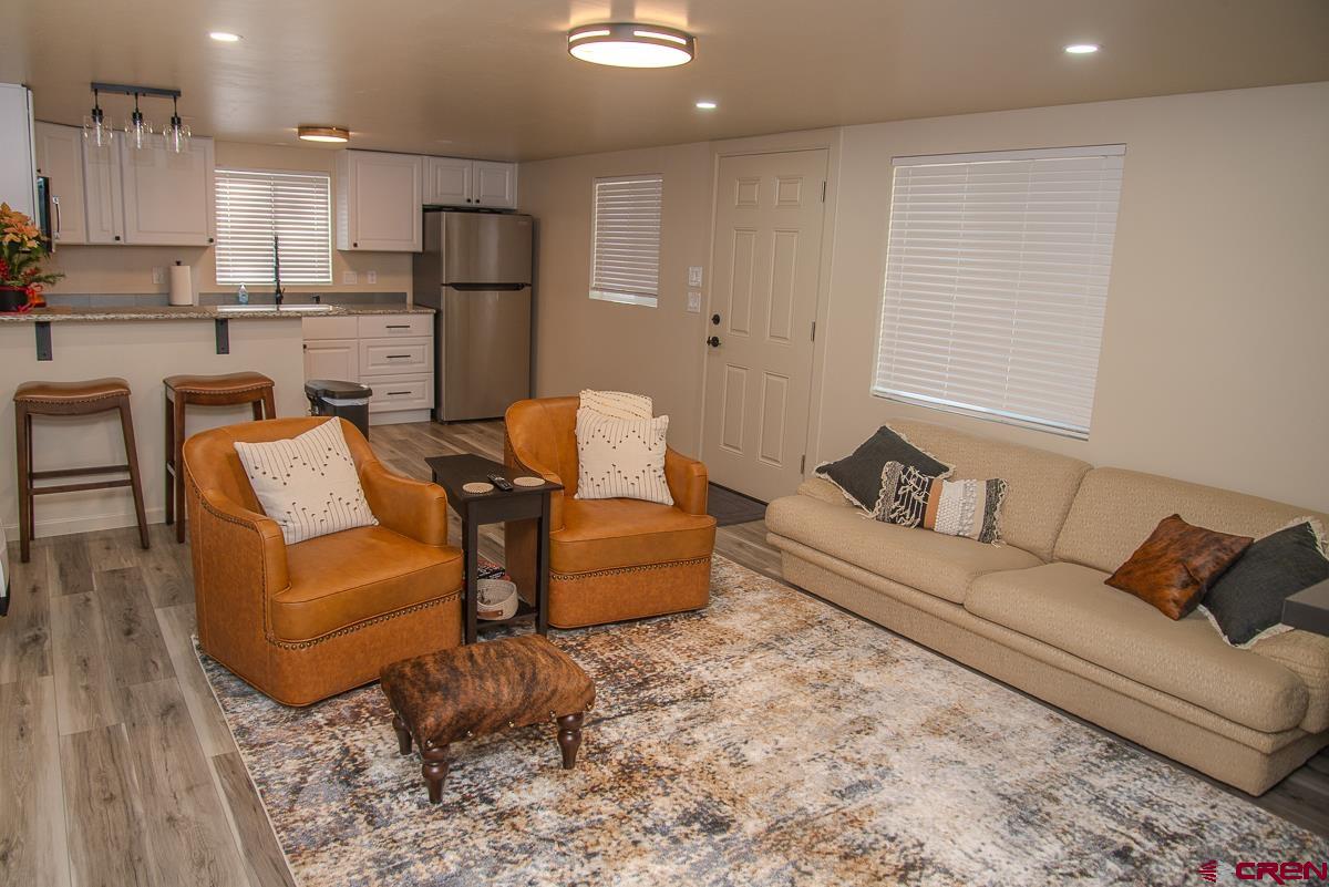 40 Hidden Lane Durango, CO 81303 - Photo 18 of 38 a living room with furniture and a wooden floor
