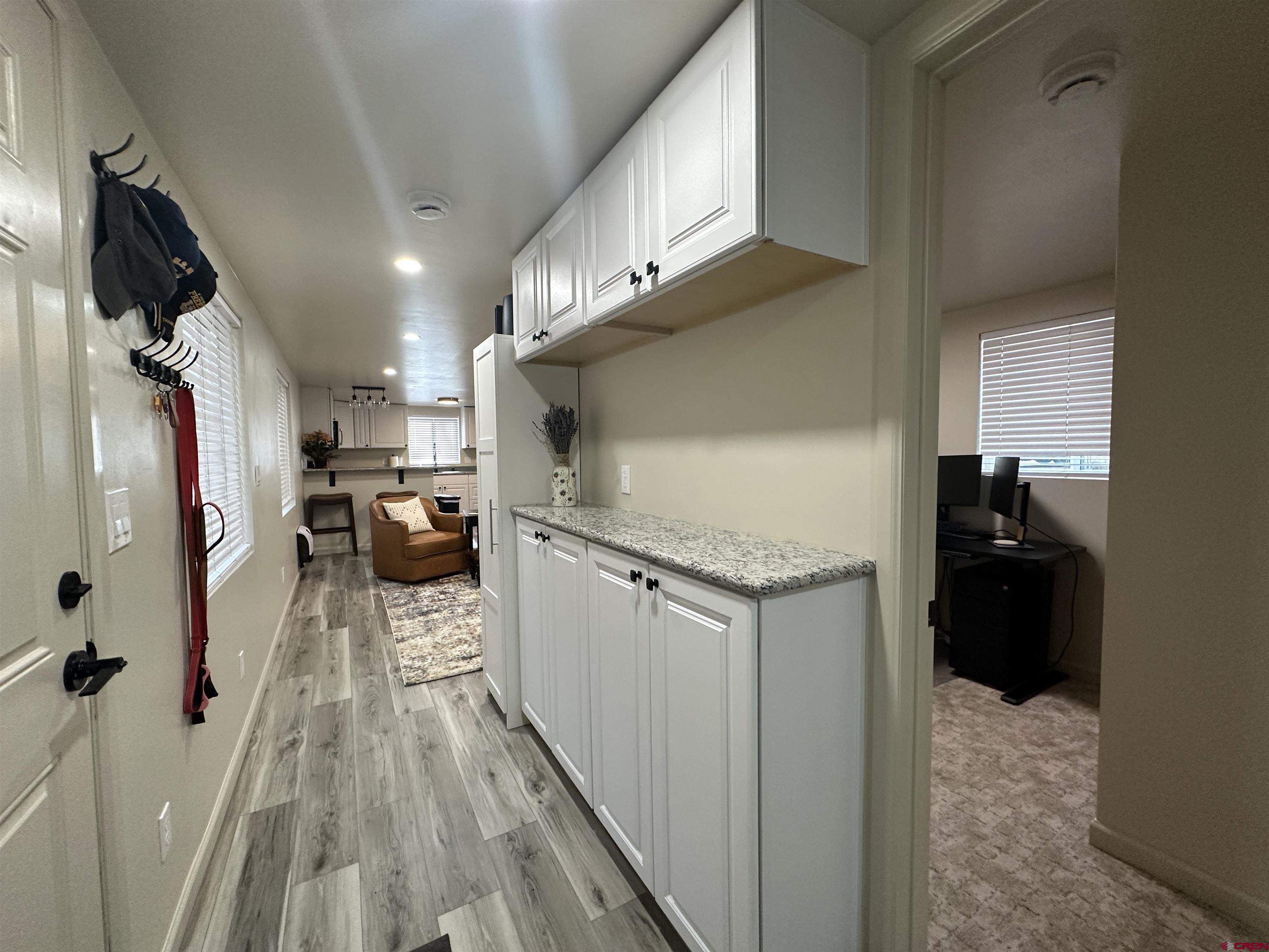 40 Hidden Lane Durango, CO 81303 - Photo 30 of 38 a kitchen with granite countertop a refrigerator and a sink