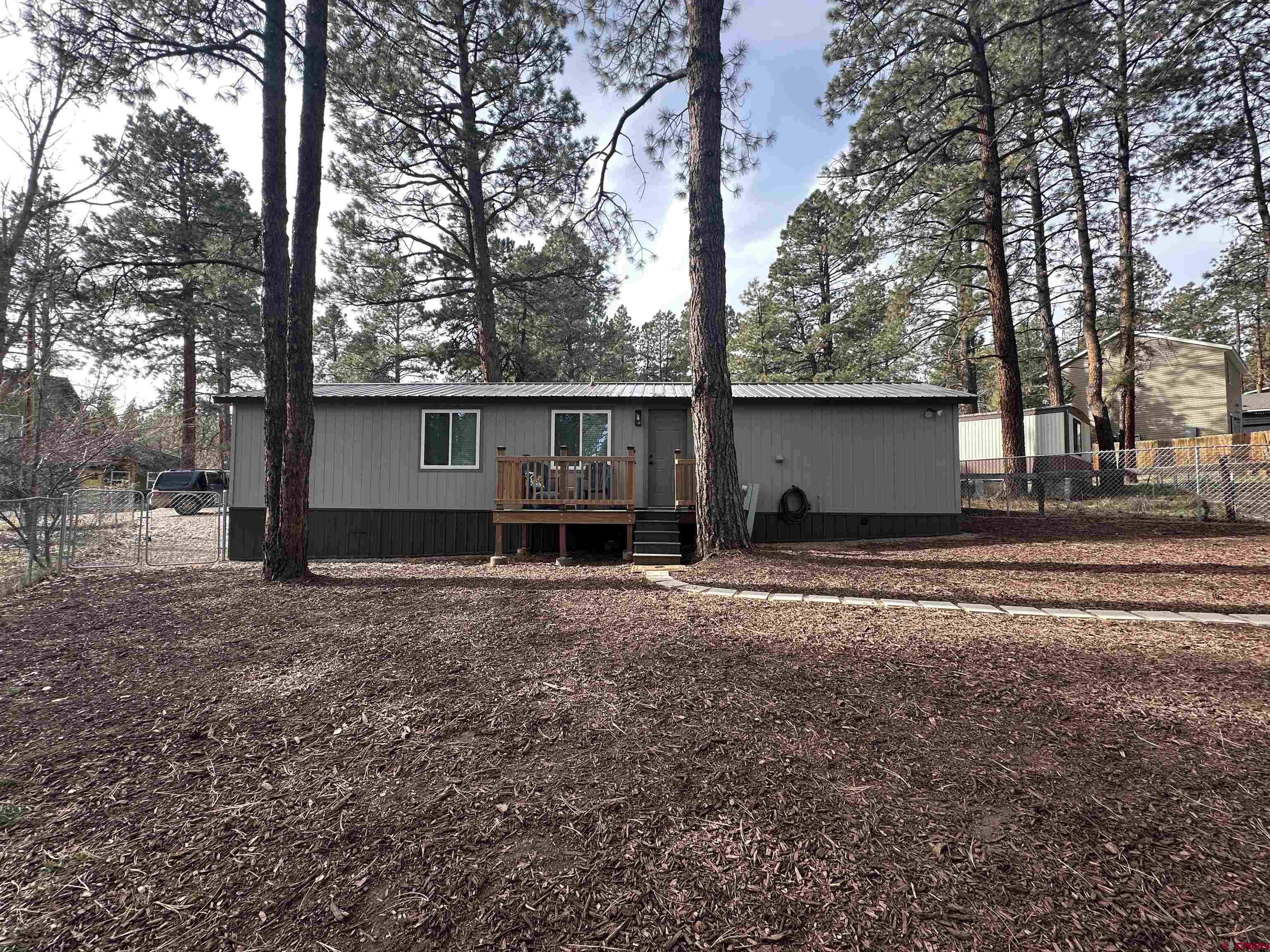 40 Hidden Lane Durango, CO 81303 - Photo 31 of 38 a view of a house with backyard and trees