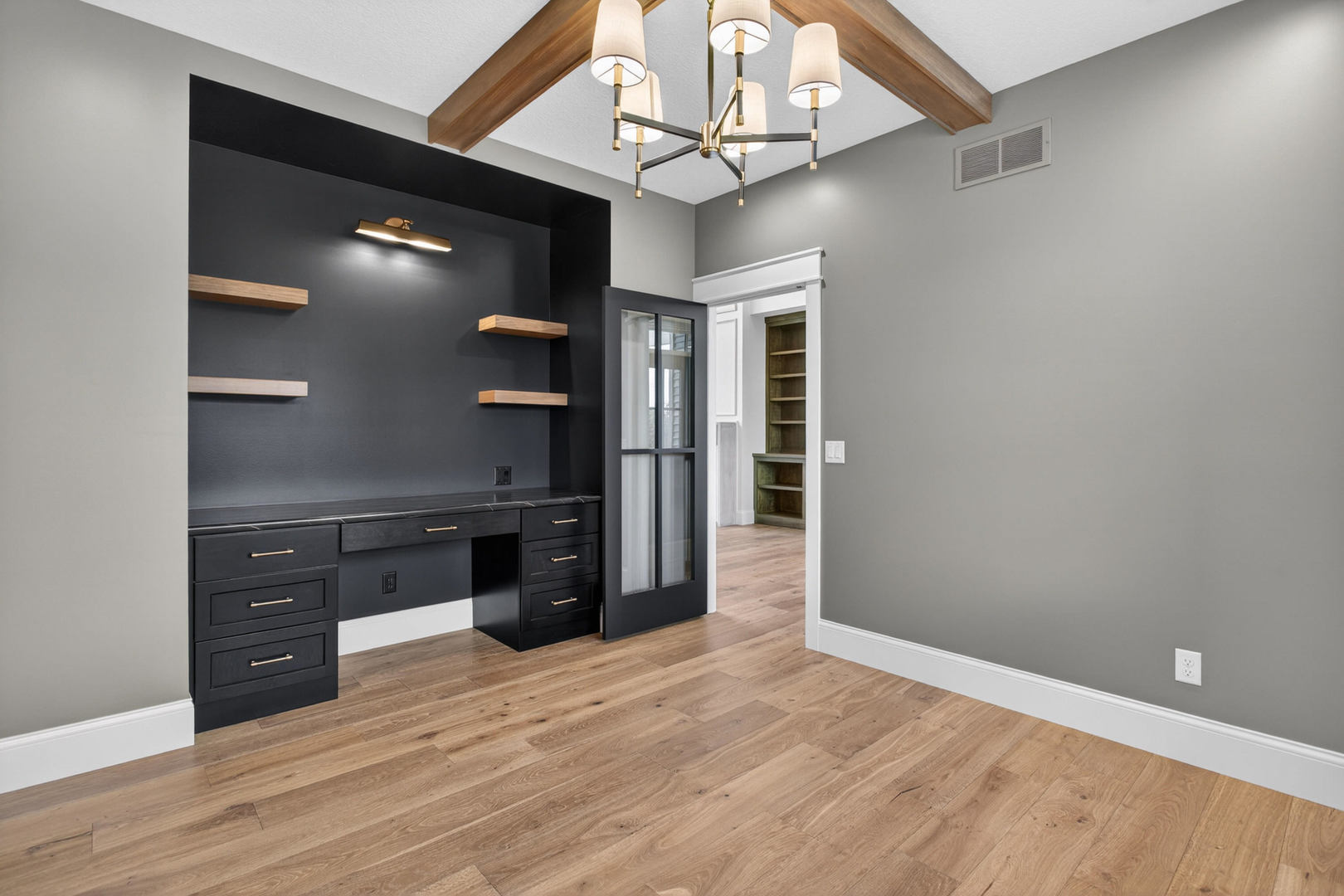 6928 Wilderness Pointe Bettendorf, IA 52722 - Photo 8 of 48 wooden floor in an empty room with a kitchen
