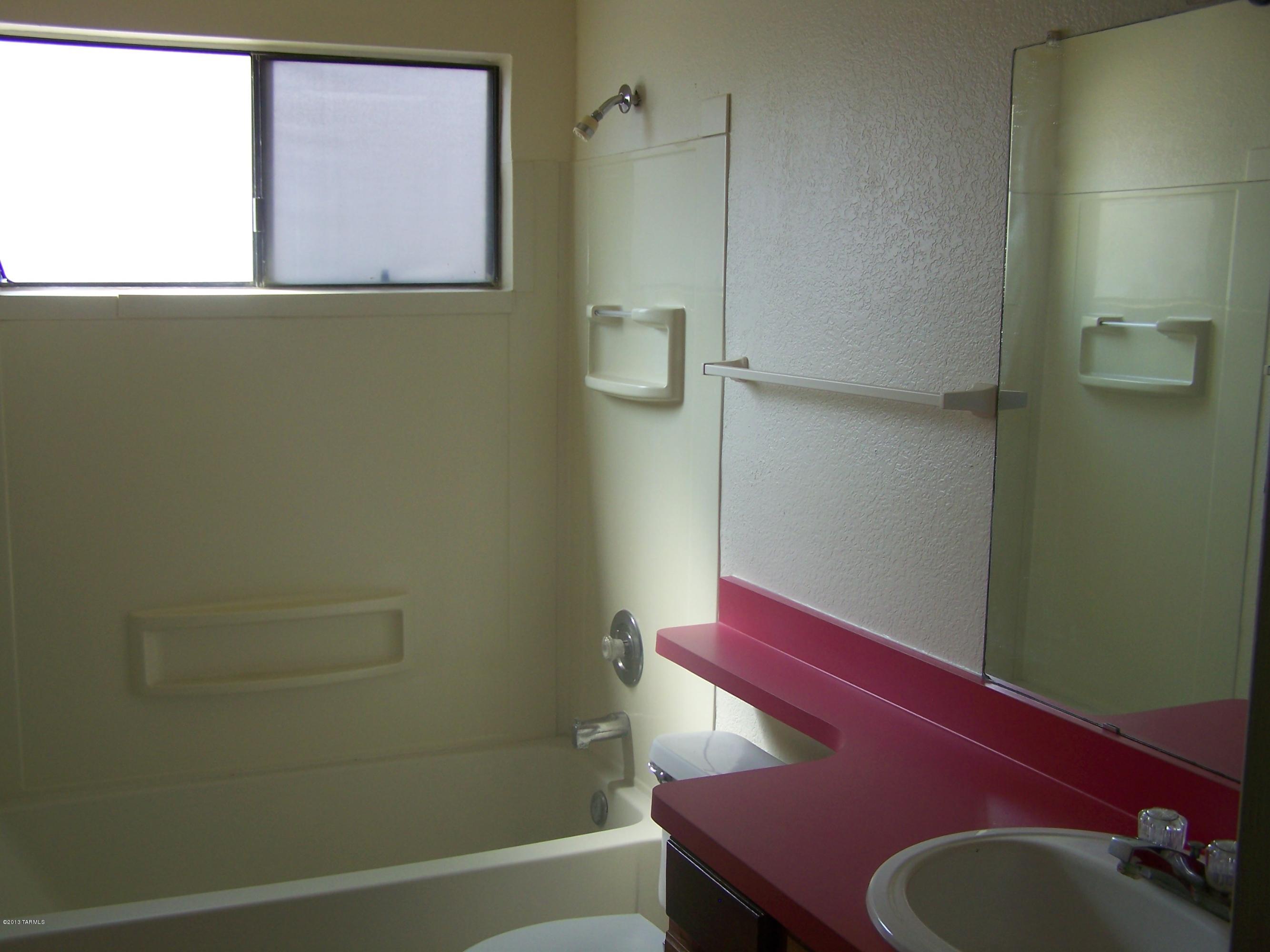2683 West Fanbrook Road Tucson, AZ 85741 - Photo 10 of 14 a room with a chair and a table