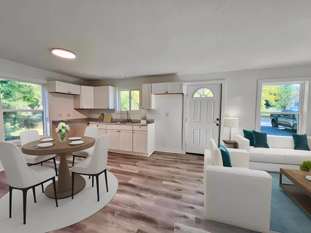 a view of a dining room with furniture and a table