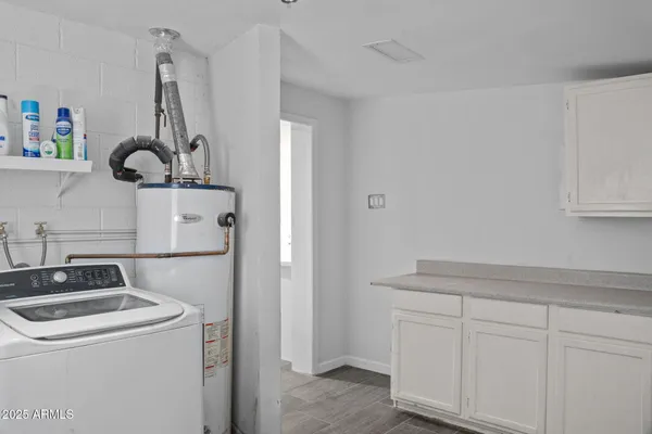 a kitchen with a sink and cabinets
