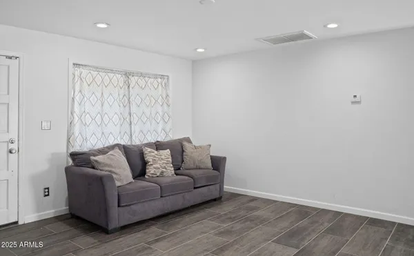 a living room with furniture and a couch