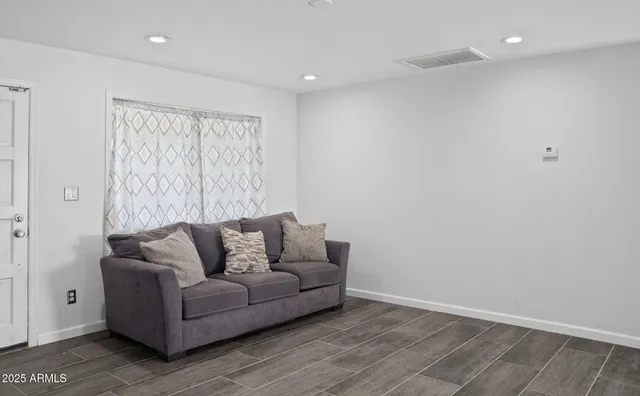 a living room with furniture and a couch