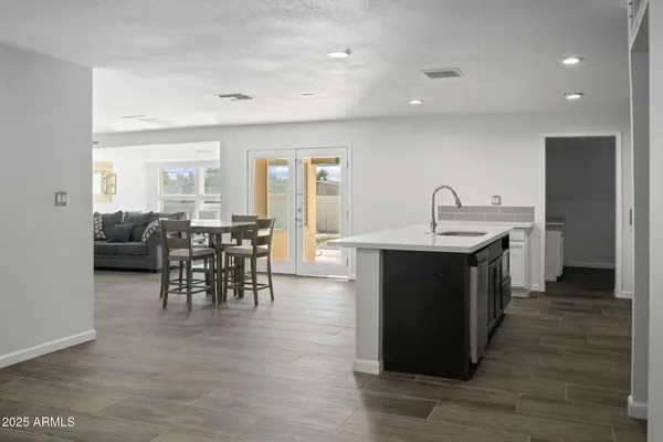 a kitchen with counter top space and sink