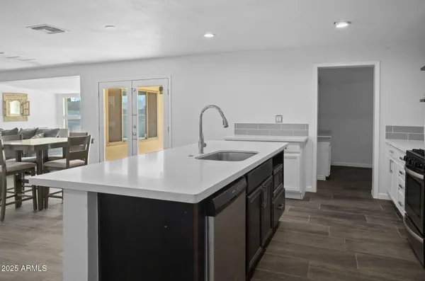 a kitchen with a sink and cabinets