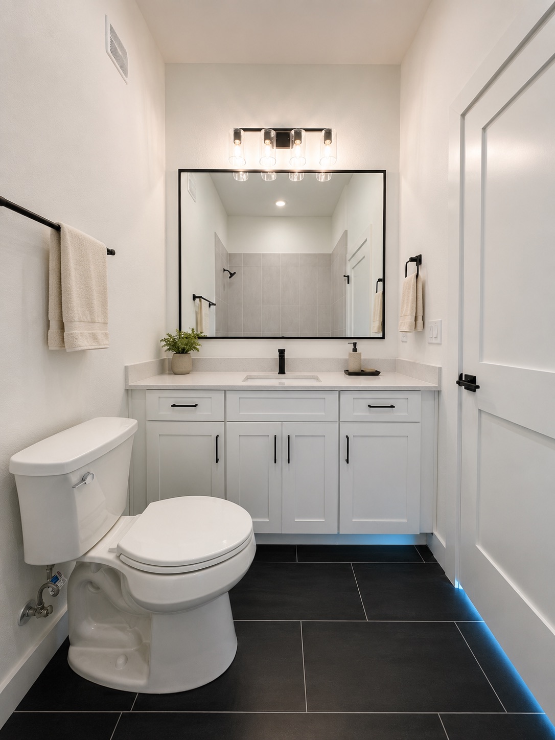 2000 Riverside Farms Road, Unit 6102 Austin, TX 78741 - Photo 9 of 11 A sleek vanity with ample storage and a contemporary mirror anchors this well-appointed bathroom.