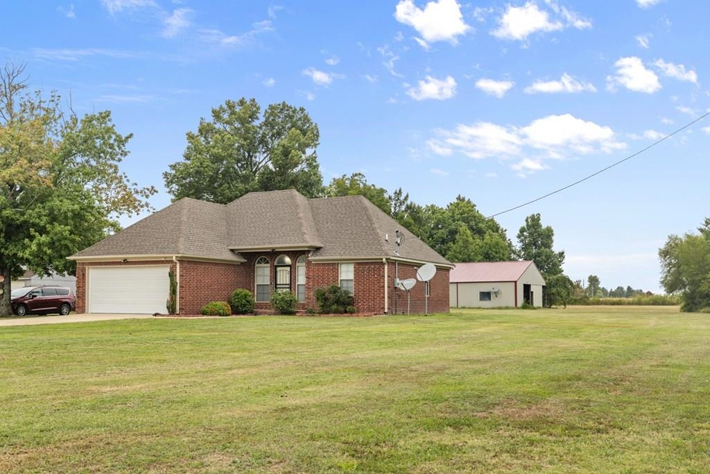 13854 Highway 70 Proctor, AR 72376 - Photo 3 of 31 a front view of a house with a garden