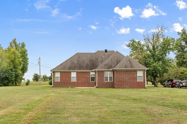 a aerial view of a house with a yard
