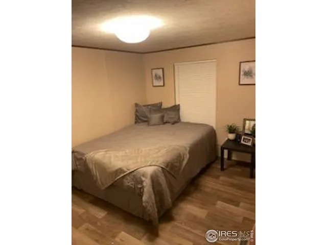 a bedroom with a bed and a cabinets