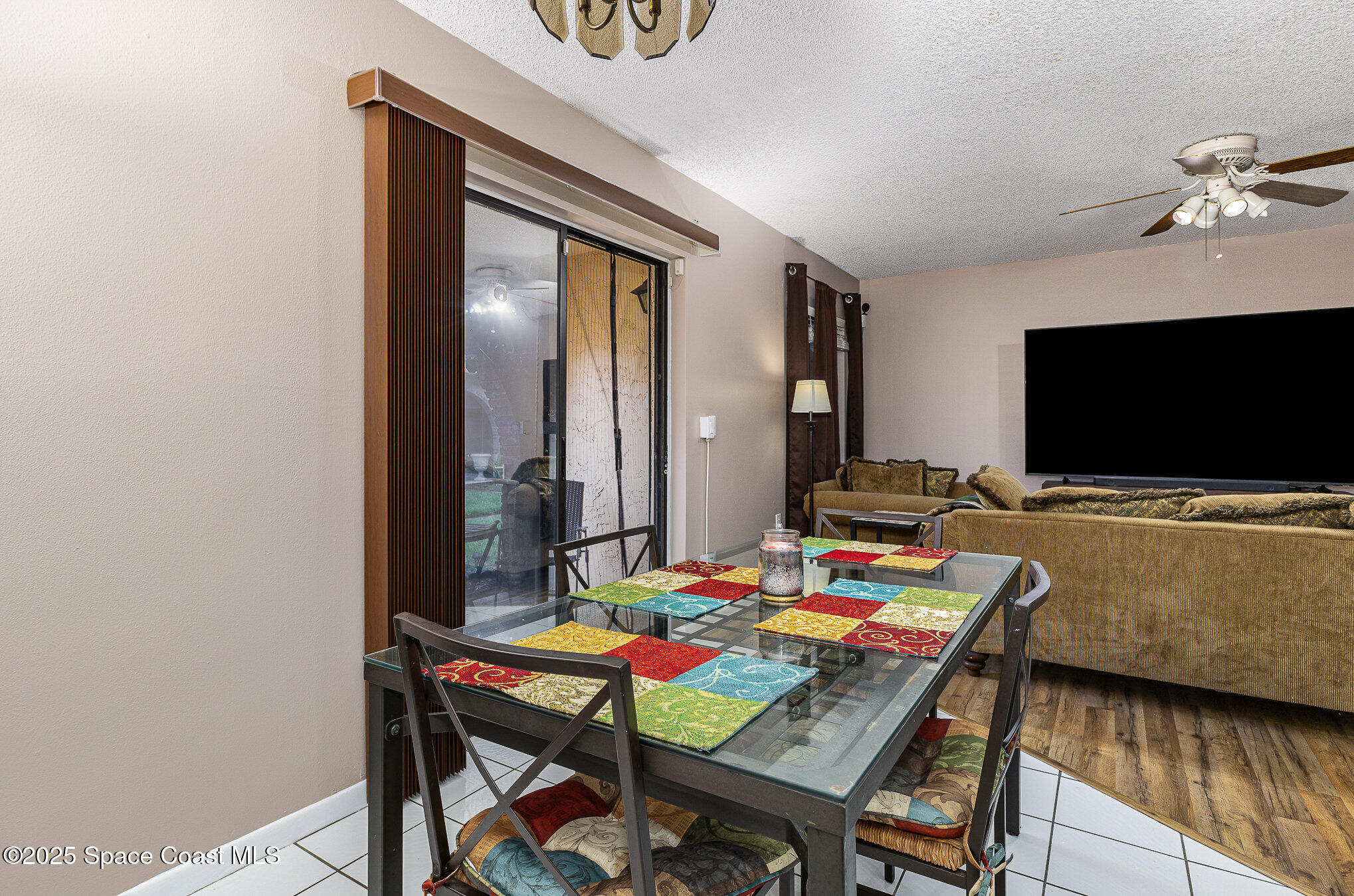 109 San Paulo Circle, Unit 15109 West Melbourne, FL 32904 - Photo 12 of 30 a living room with furniture and a flat screen tv