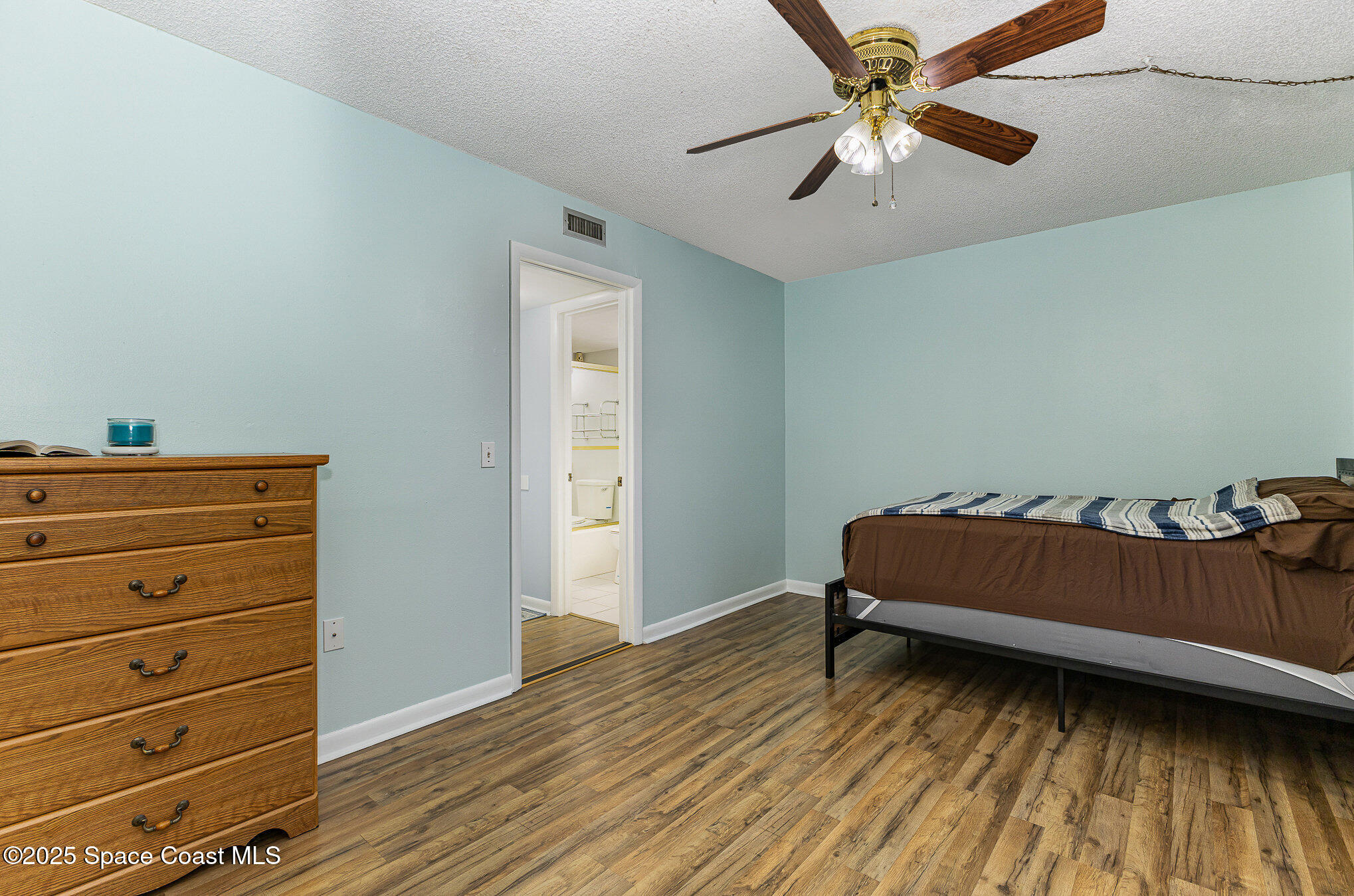 109 San Paulo Circle, Unit 15109 West Melbourne, FL 32904 - Photo 20 of 30 a room with chair and a ceiling fan