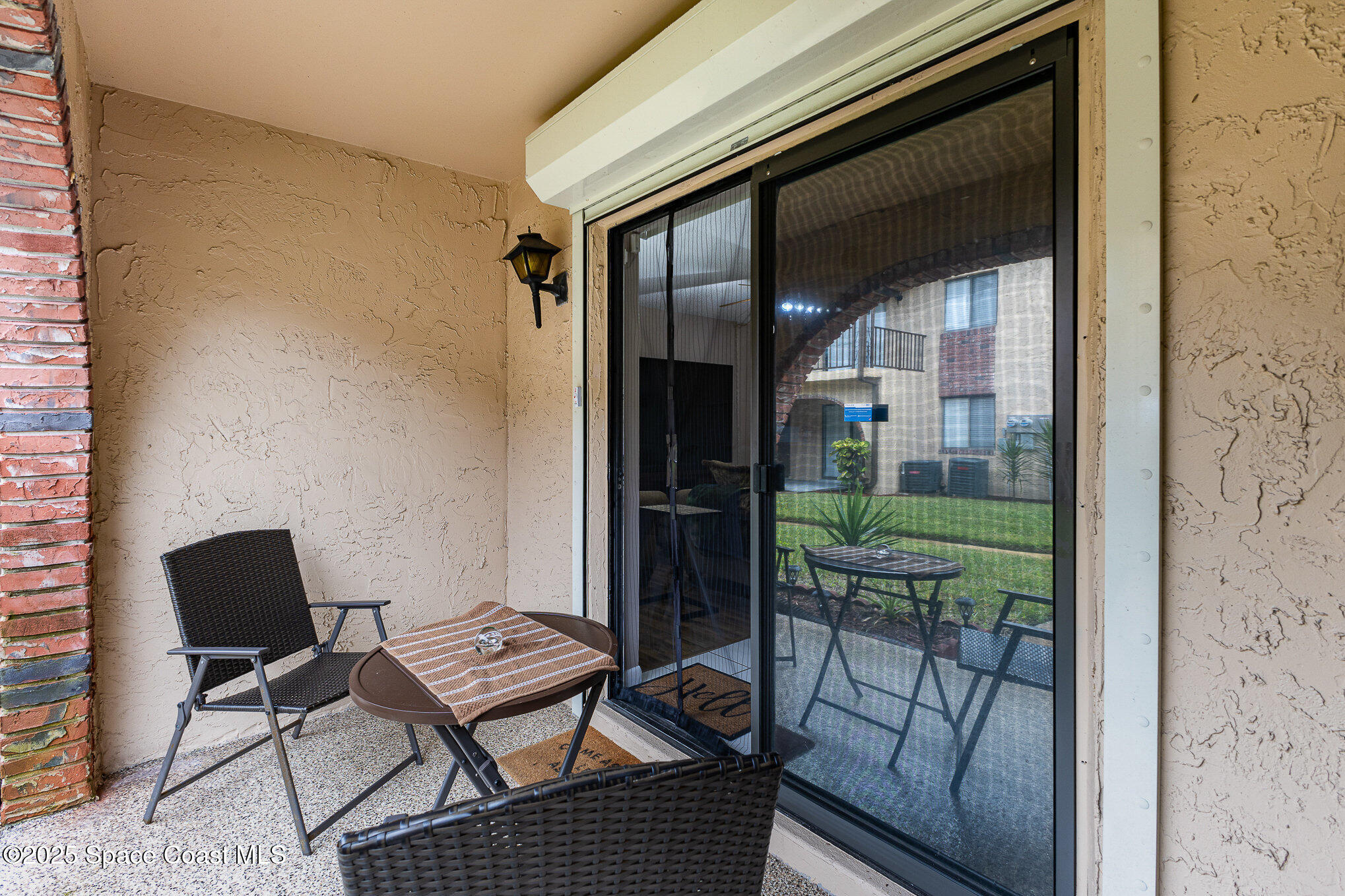 109 San Paulo Circle, Unit 15109 West Melbourne, FL 32904 - Photo 22 of 30 a outdoor space with patio