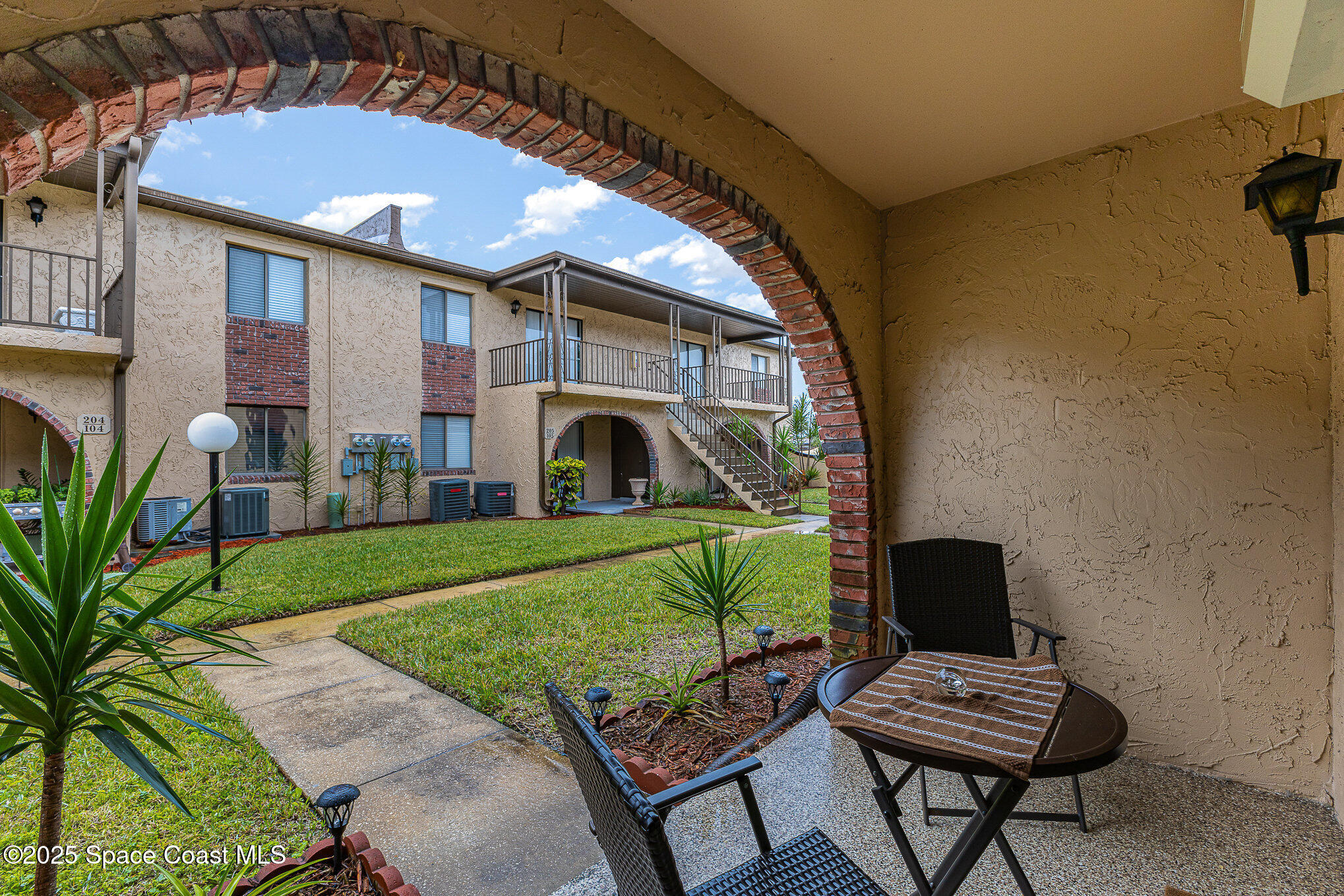 109 San Paulo Circle, Unit 15109 West Melbourne, FL 32904 - Photo 23 of 30 a view of backyard with swimming pool and outdoor seating