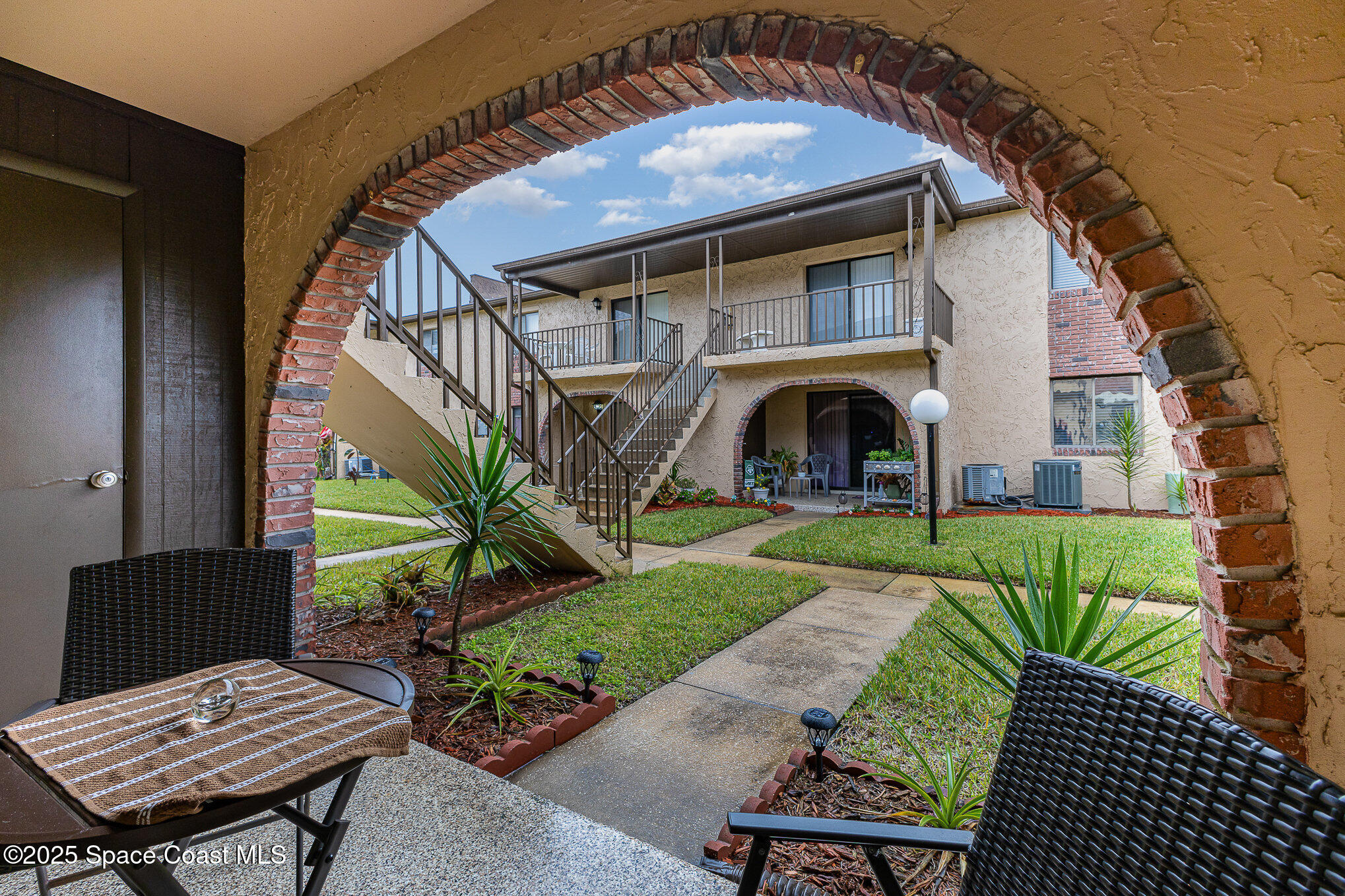 109 San Paulo Circle, Unit 15109 West Melbourne, FL 32904 - Photo 24 of 30 a view of a couches in patio of a house