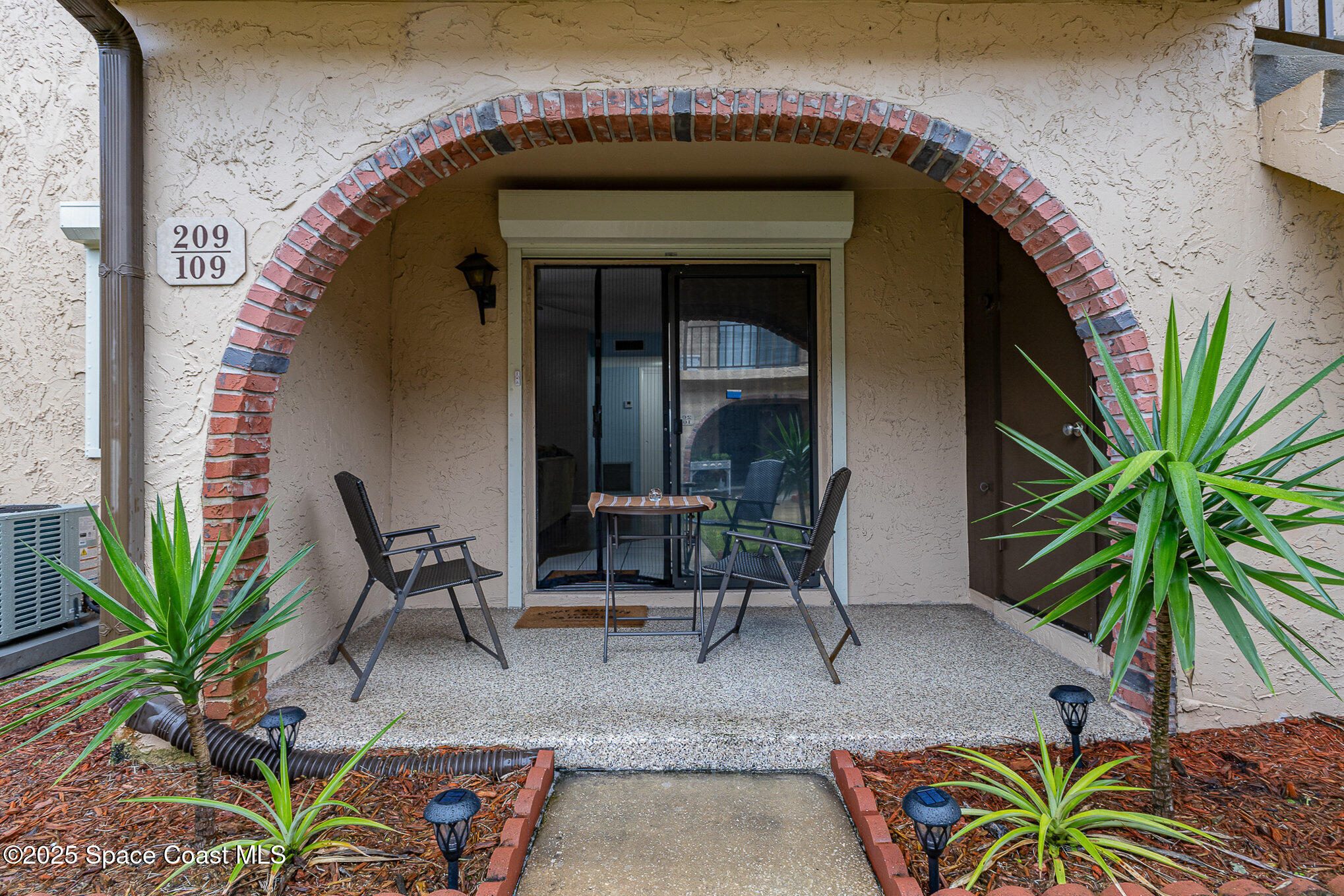 109 San Paulo Circle, Unit 15109 West Melbourne, FL 32904 - Photo 25 of 30 a view of house with outdoor seating and entertaining space