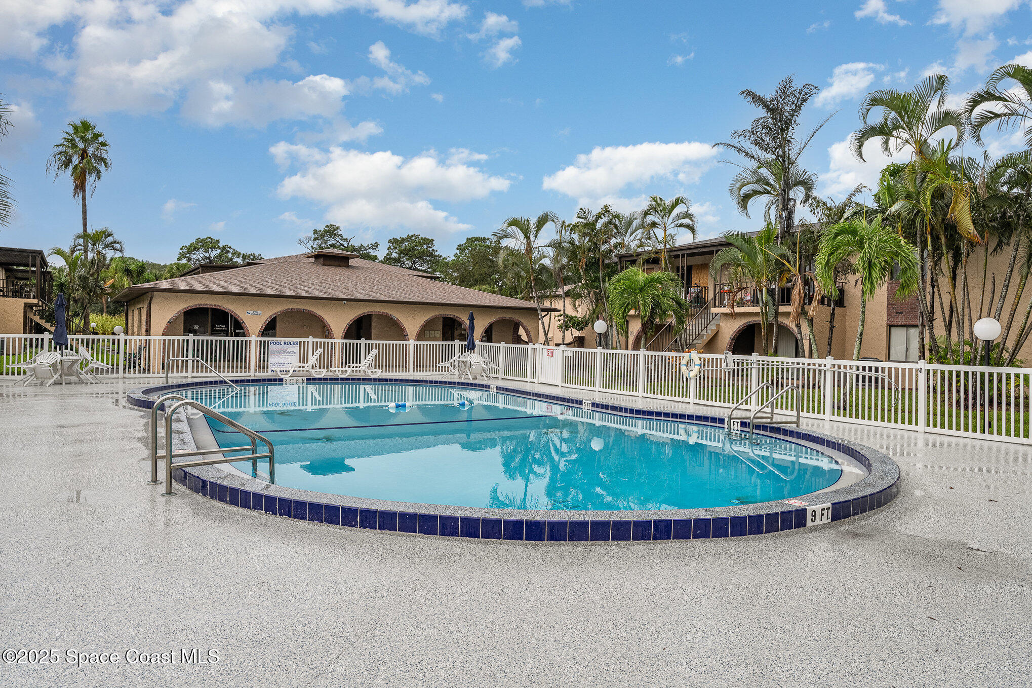 109 San Paulo Circle, Unit 15109 West Melbourne, FL 32904 - Photo 27 of 30 a view of a swimming pool with a garden