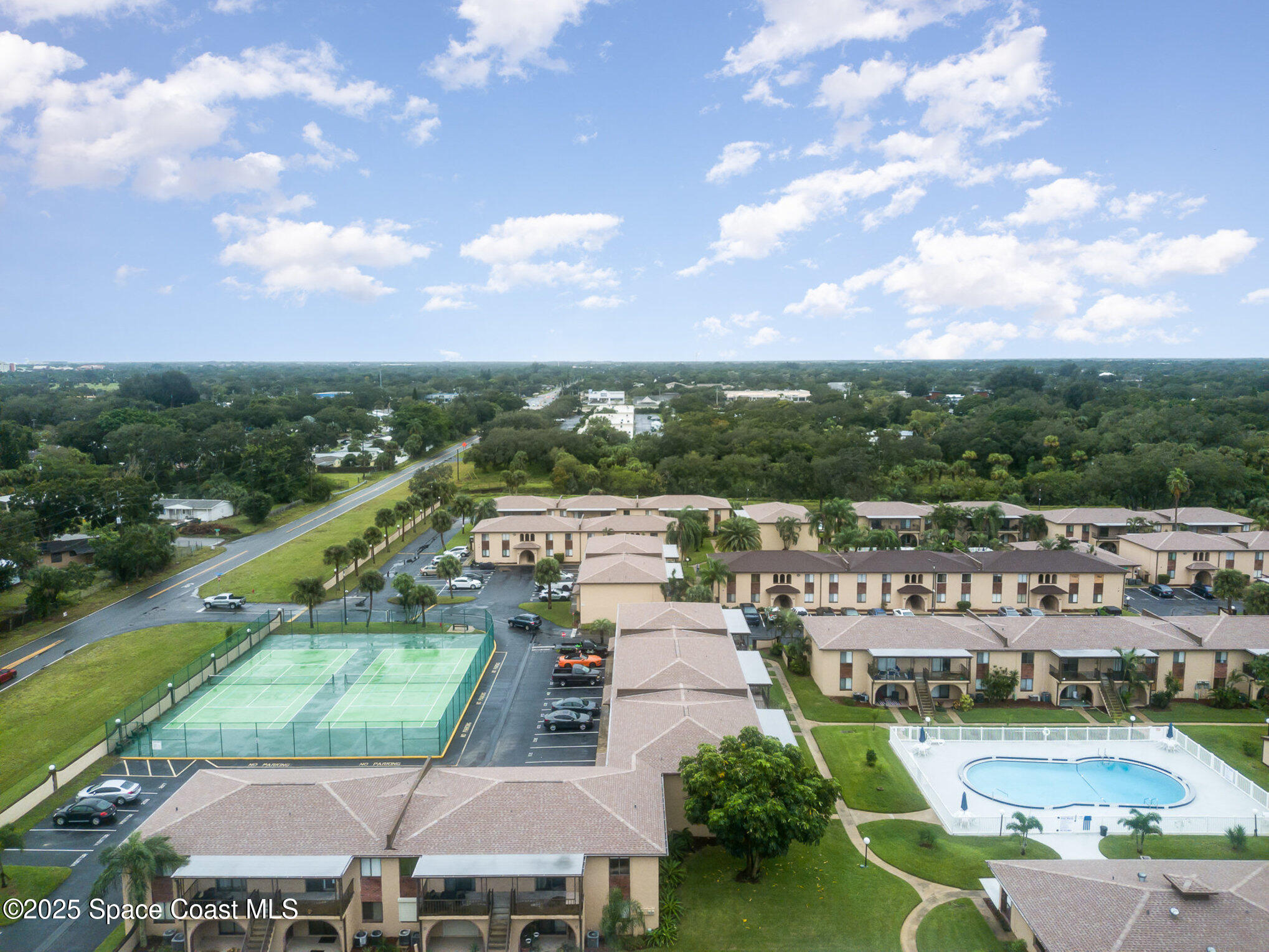 109 San Paulo Circle, Unit 15109 West Melbourne, FL 32904 - Photo 30 of 30 a view of a city with lawn chairs