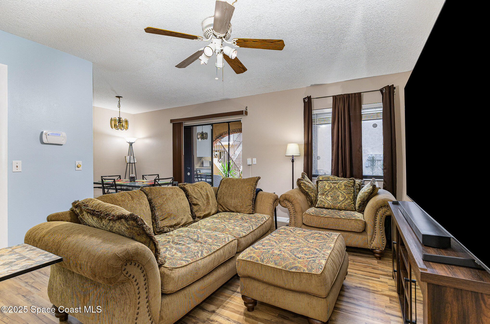 109 San Paulo Circle, Unit 15109 West Melbourne, FL 32904 - Photo 4 of 30 a living room with furniture and a couch