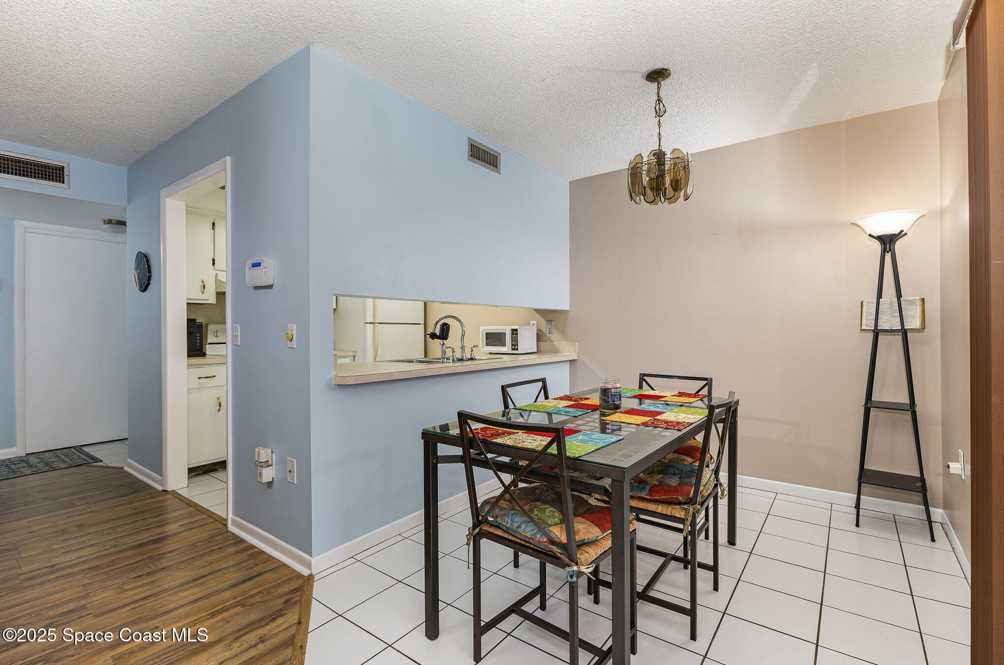 109 San Paulo Circle, Unit 15109 West Melbourne, FL 32904 - Photo 9 of 30 a dining room with a table and chairs