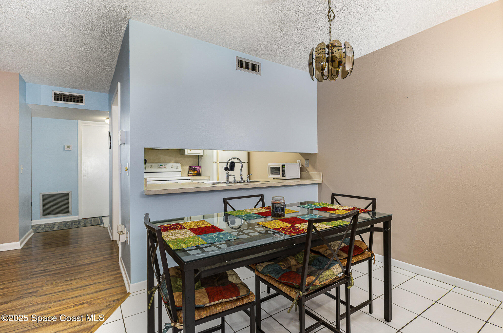 109 San Paulo Circle, Unit 15109 West Melbourne, FL 32904 - Photo 10 of 30 a room that has a table and chairs in it