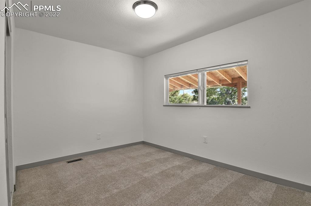 24365 Elbert Road Elbert, CO 80106 - Photo 11 of 19 an empty room with windows