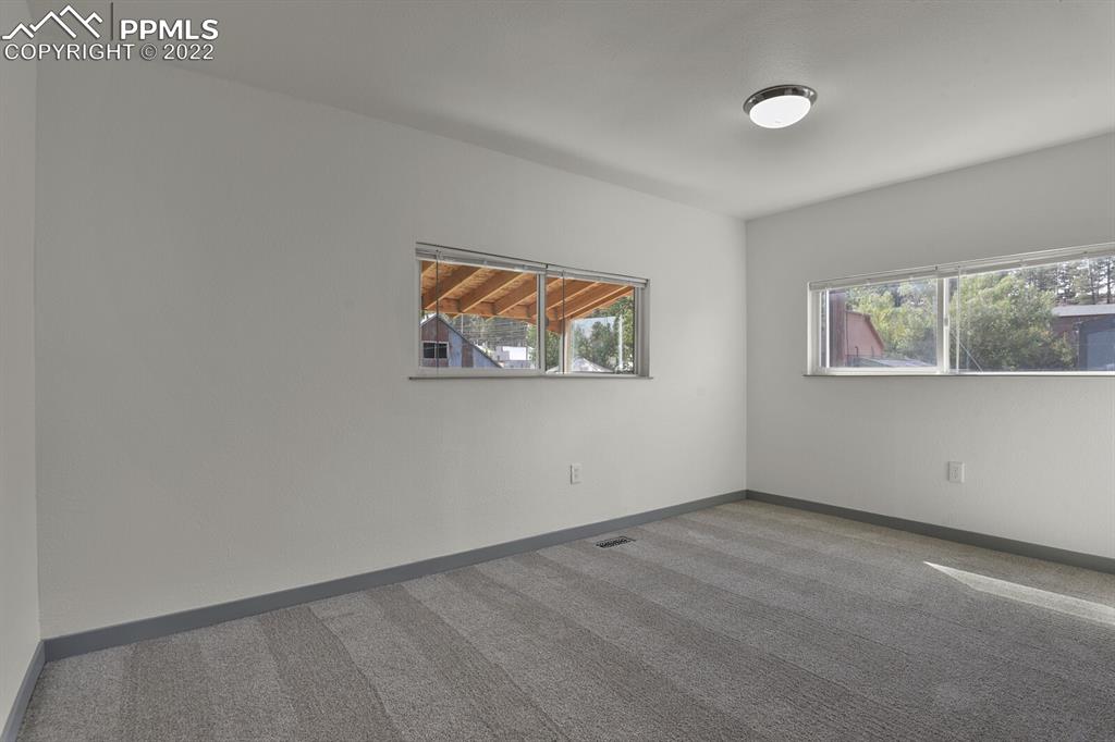 24365 Elbert Road Elbert, CO 80106 - Photo 14 of 19 an empty room with windows