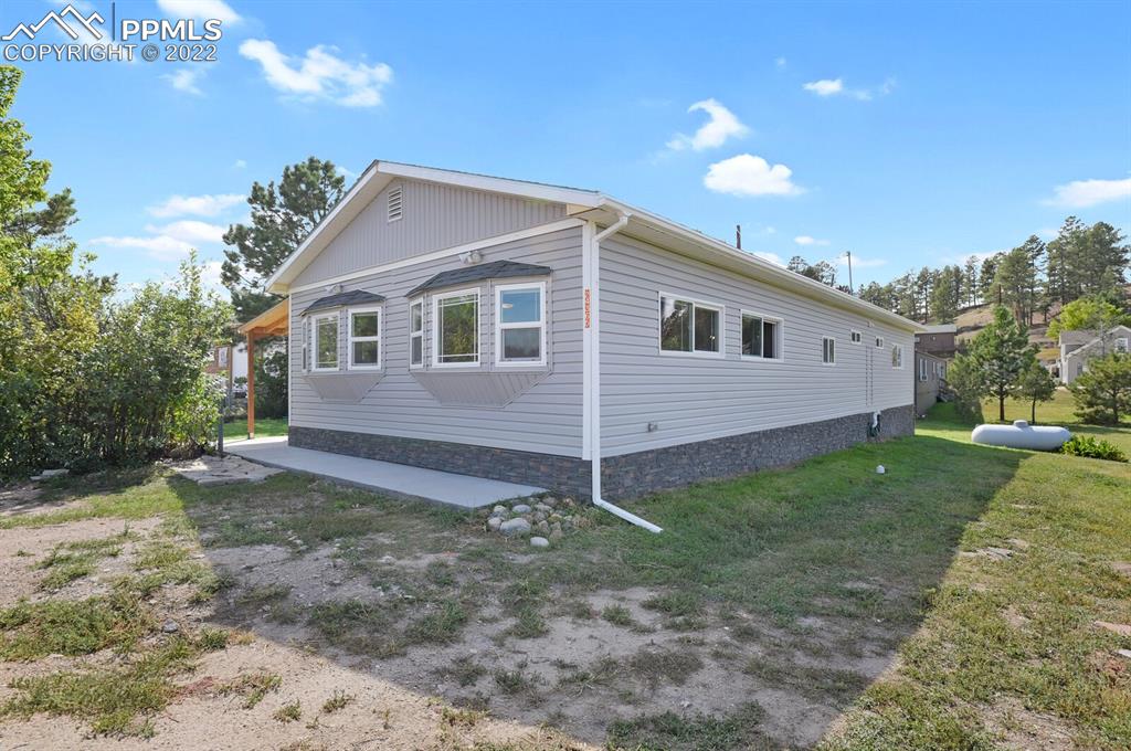 24365 Elbert Road Elbert, CO 80106 - Photo 3 of 19 a view of a house with a yard