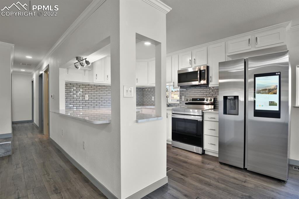 24365 Elbert Road Elbert, CO 80106 - Photo 9 of 19 a kitchen with stainless steel appliances a refrigerator sink and microwave