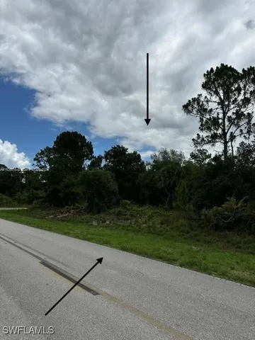 a view of a road with a yard