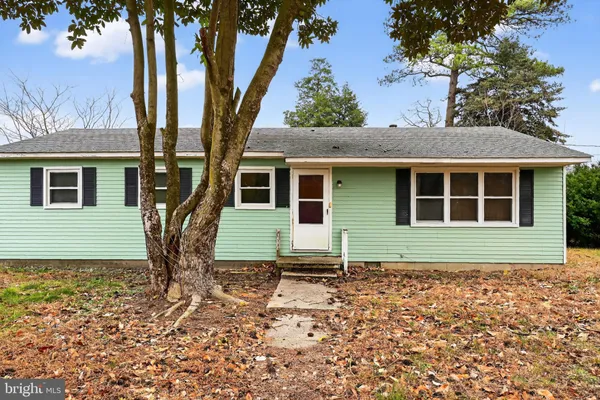 a house with trees in the background