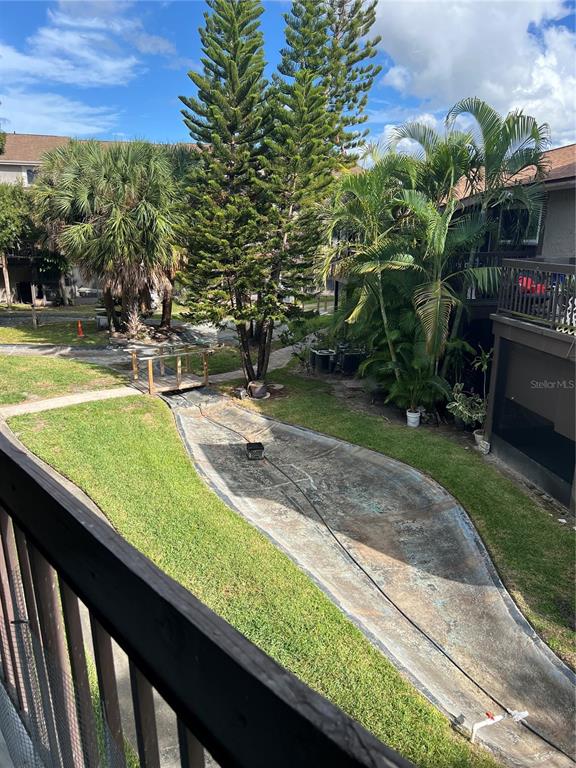 6312 Newtown Circle, Unit 12B3 Tampa, FL 33615 - Photo 8 of 10 a view of a swimming pool with a patio
