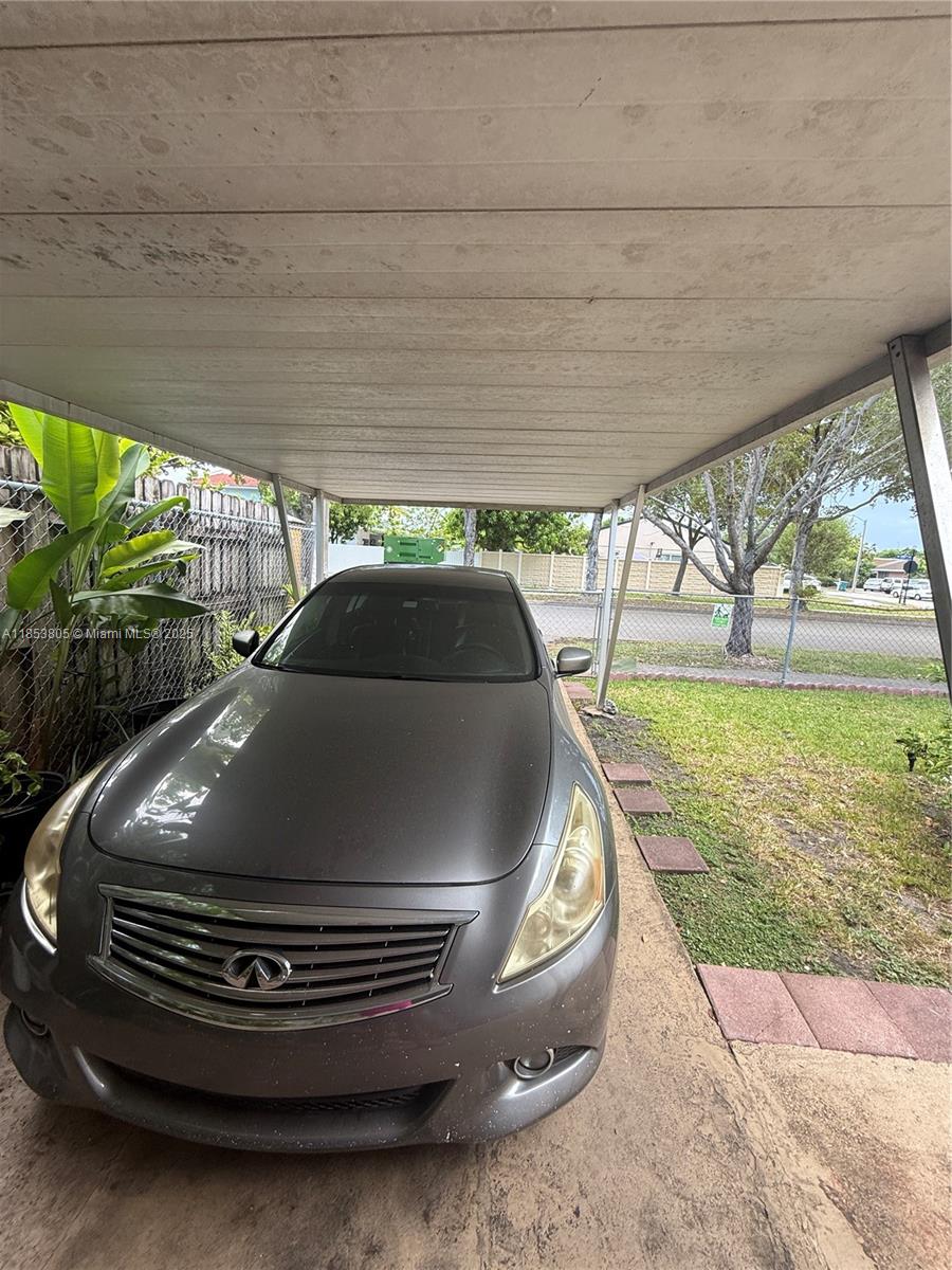 11472 Southwest 4th Street Sweetwater, FL 33174 - Photo 13 of 65 a car parked in front of a house