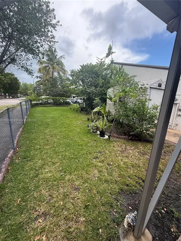a black and white checkered floor with a rug