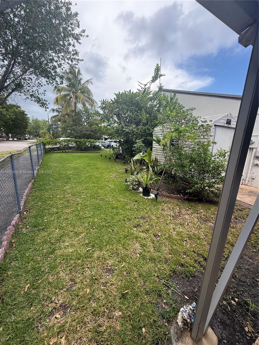 11472 Southwest 4th Street Sweetwater, FL 33174 - Photo 15 of 65 a backyard of a house with lots of green space
